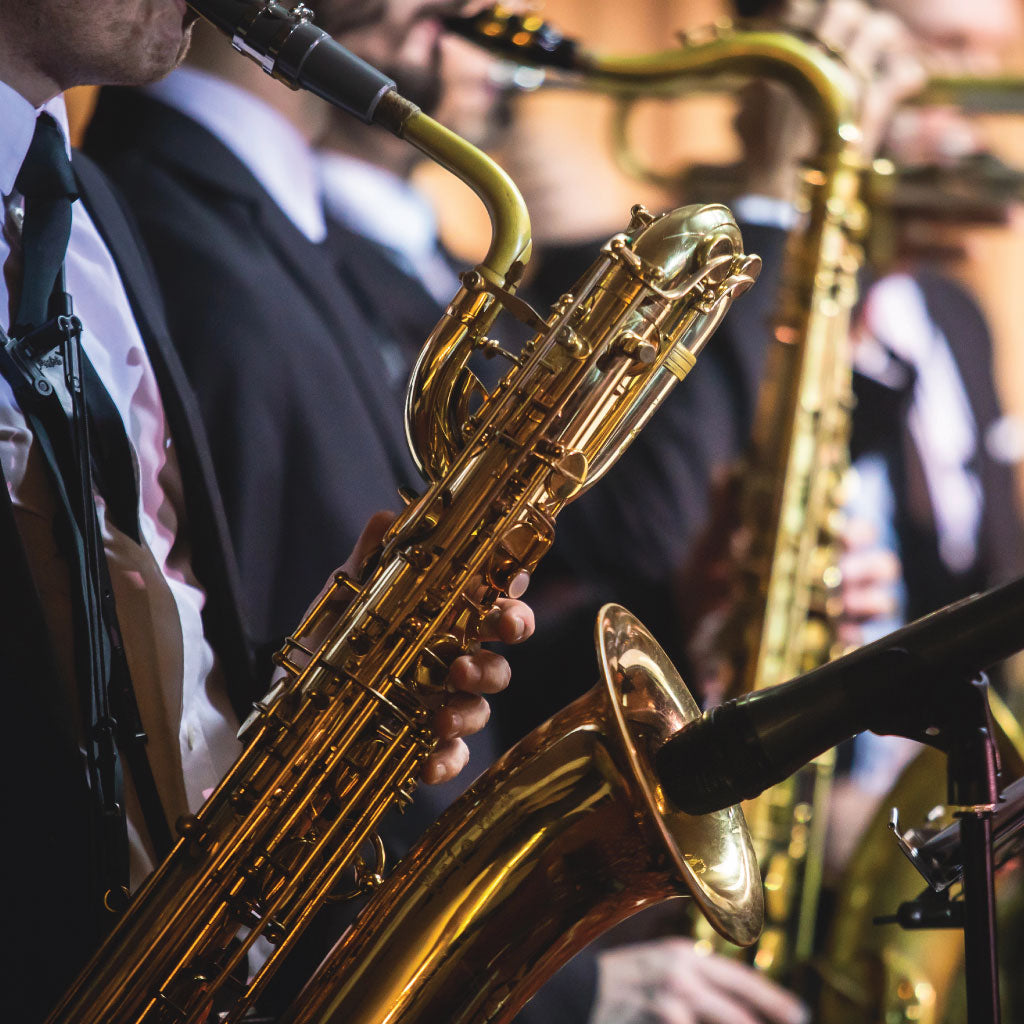 Close-up of the saxophone section in a band