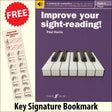 front cover of Improve Your Sight-Reading Piano Grade 4 together with free Piano Clef bookmark